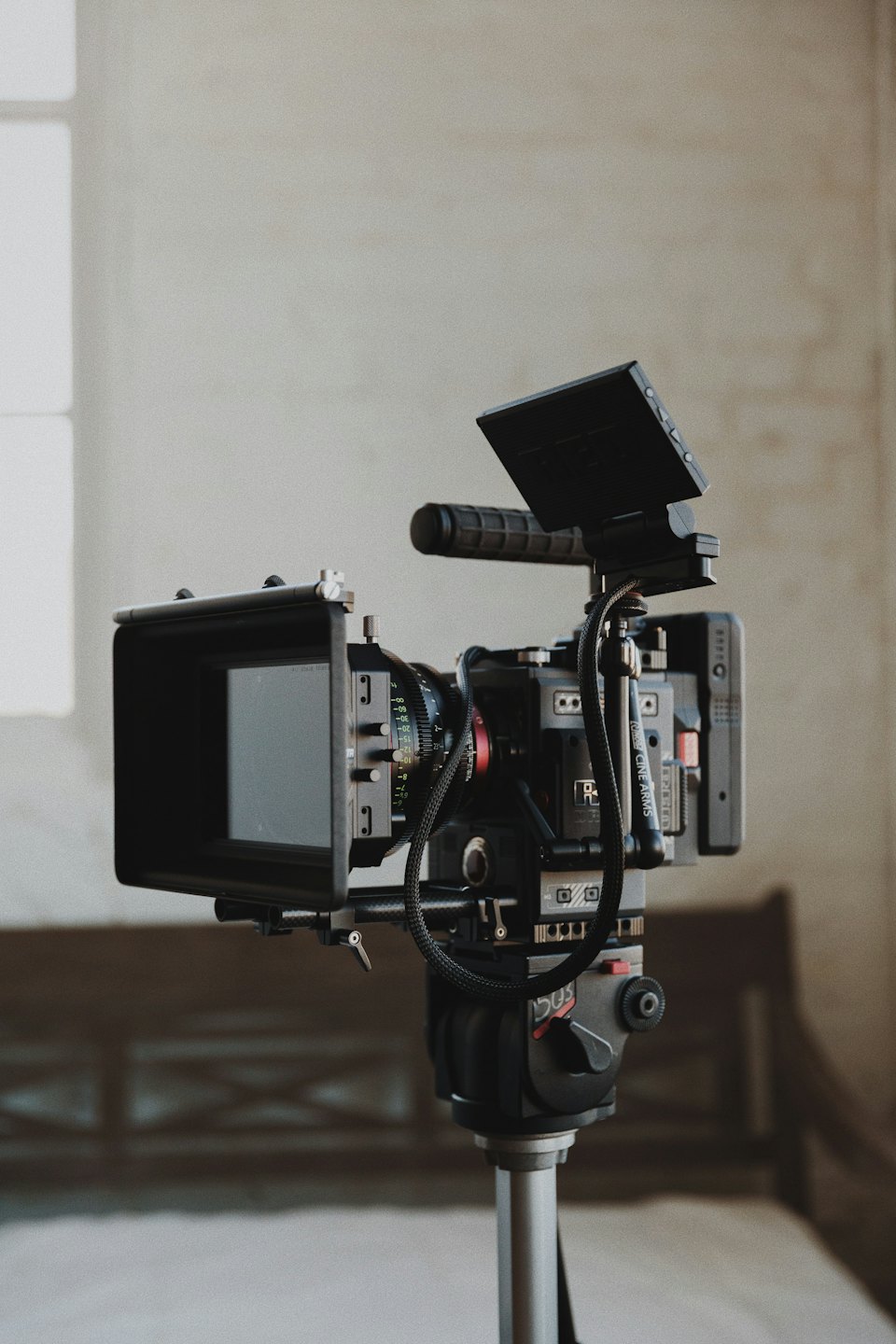 Professional cinema camera on a tripod ready for filming.